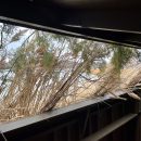 an open window slot in the interior of a duck hunting blind