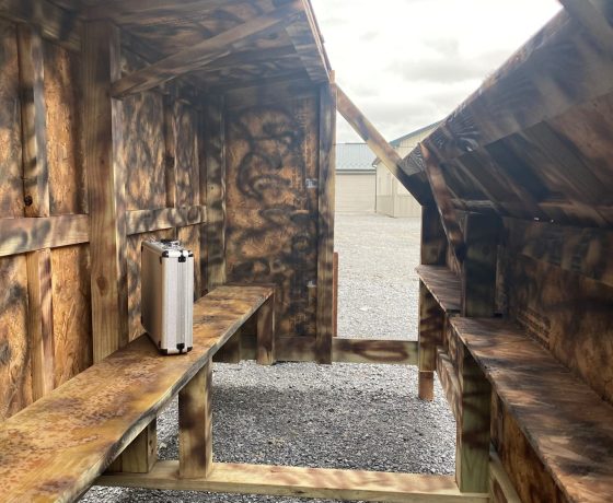 the camouflage wooden interior of a duck hunting blind
