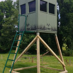 a square booner blind for sale atop of a tall stand