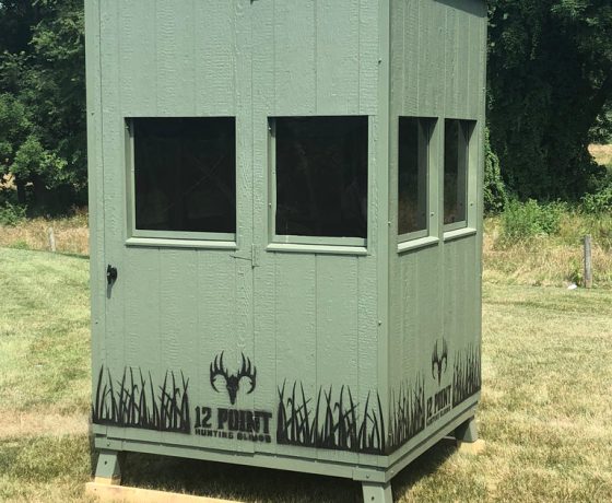the green exterior of a square hunting booner blind for sale with 4 windows